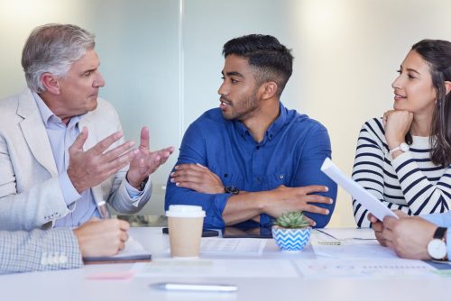 Shot of a group of businesspeople having a meeting at work.